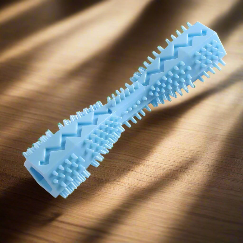 Blue dog toy with textured surface on a white background