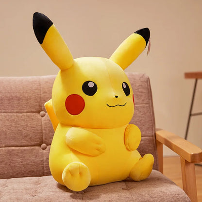 Large Pikachu plush toy sitting on a chair with a neutral background