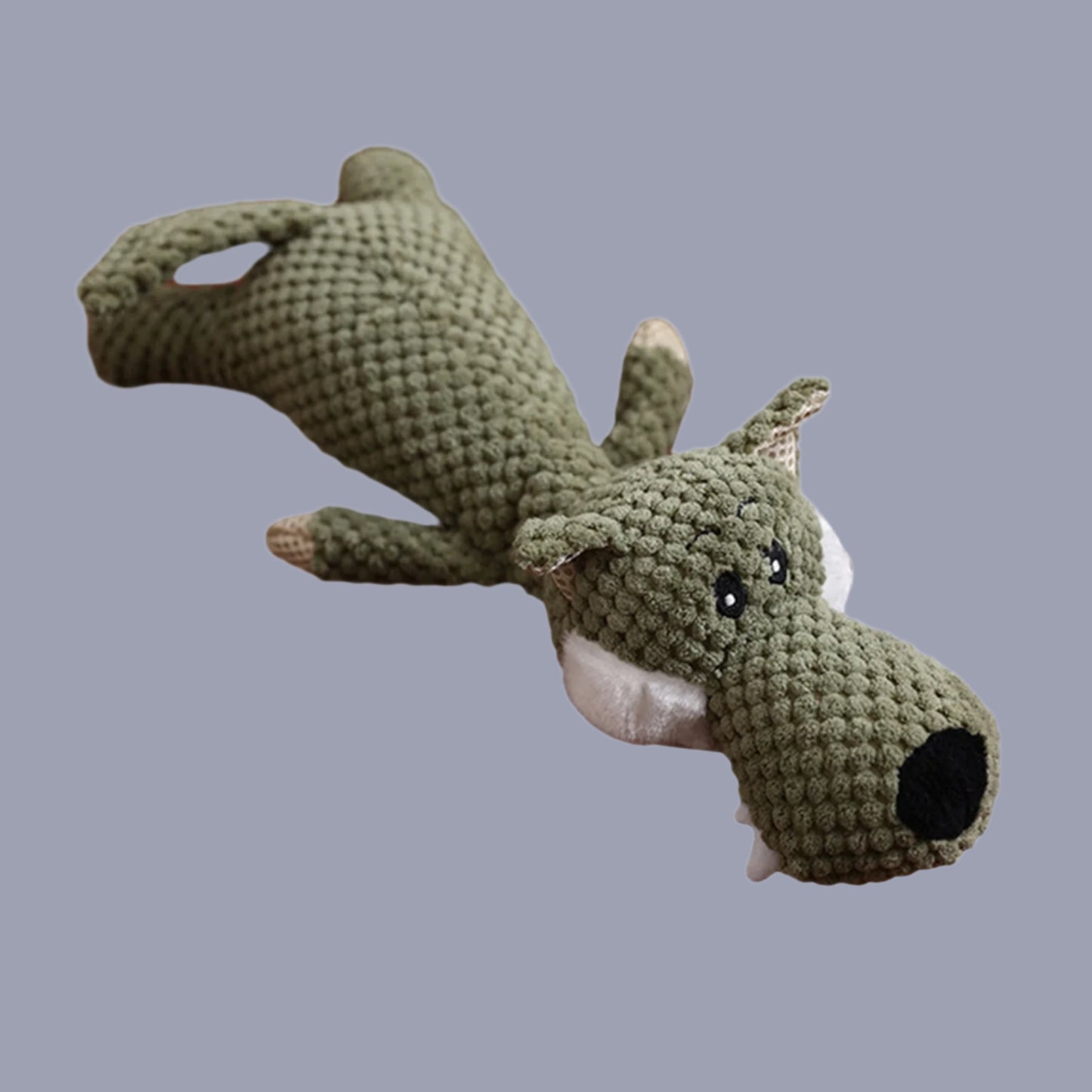 Crocheted alligator toy on a white background