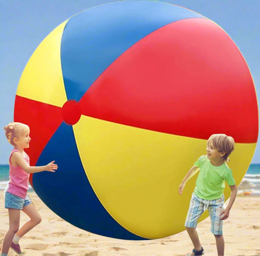 Two children playing with a large colorful beach ball